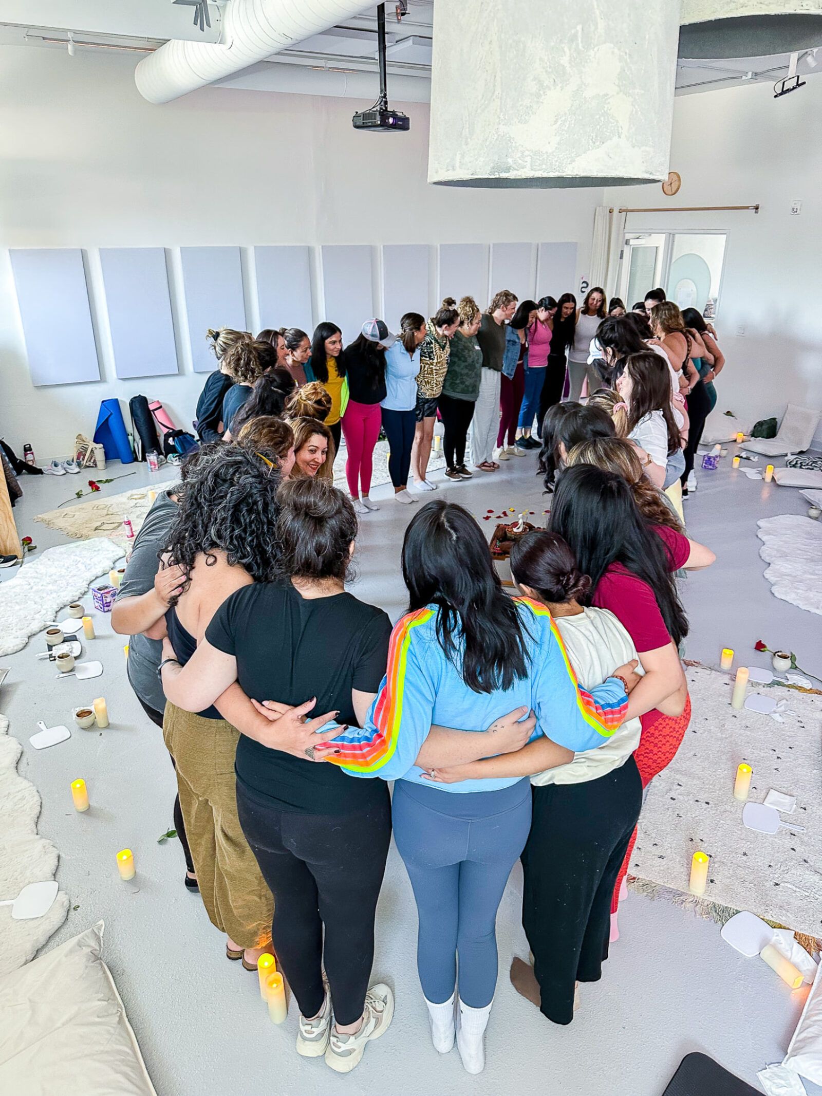 Members standing arm in arm in a closing circle