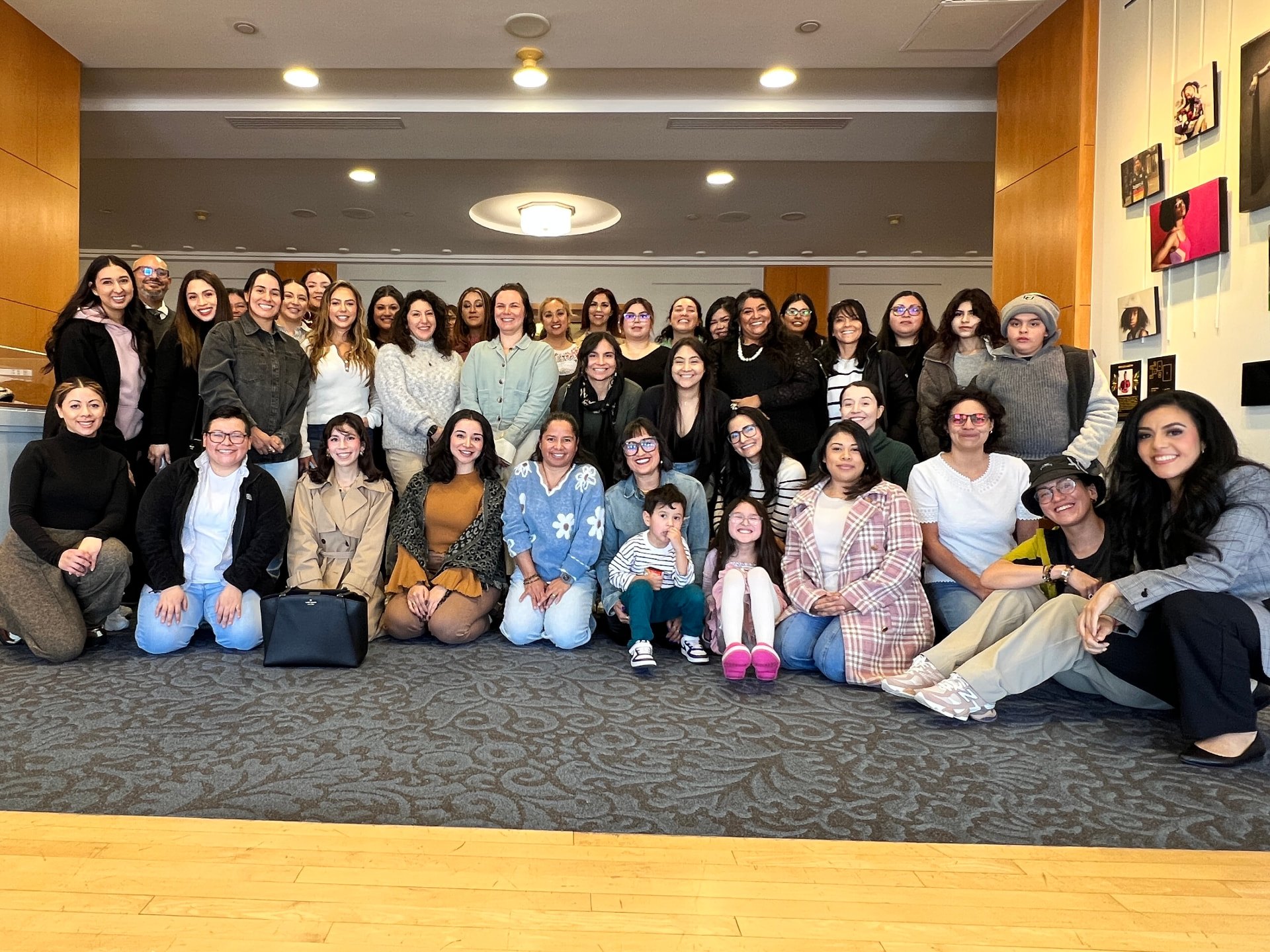 Amigas in Tech members gathered together at a community event